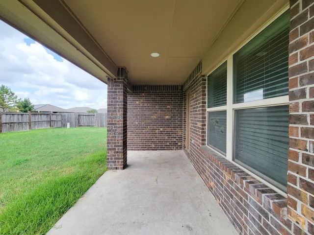 a view of a porch with a backyard