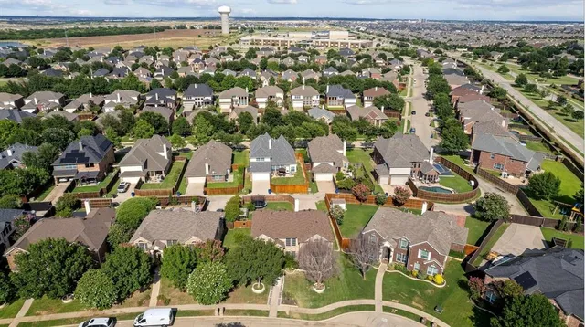 an aerial view of a city with lots of residential buildings