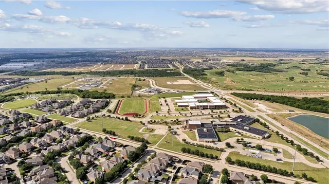 an aerial view of residential building and ocean