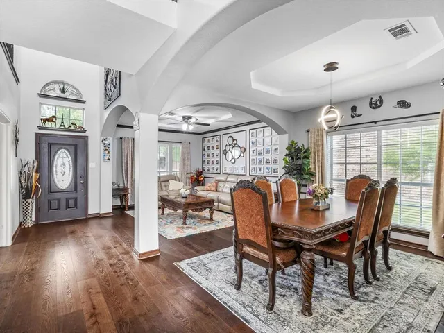 a view of a dining room with furniture window and wooden floor