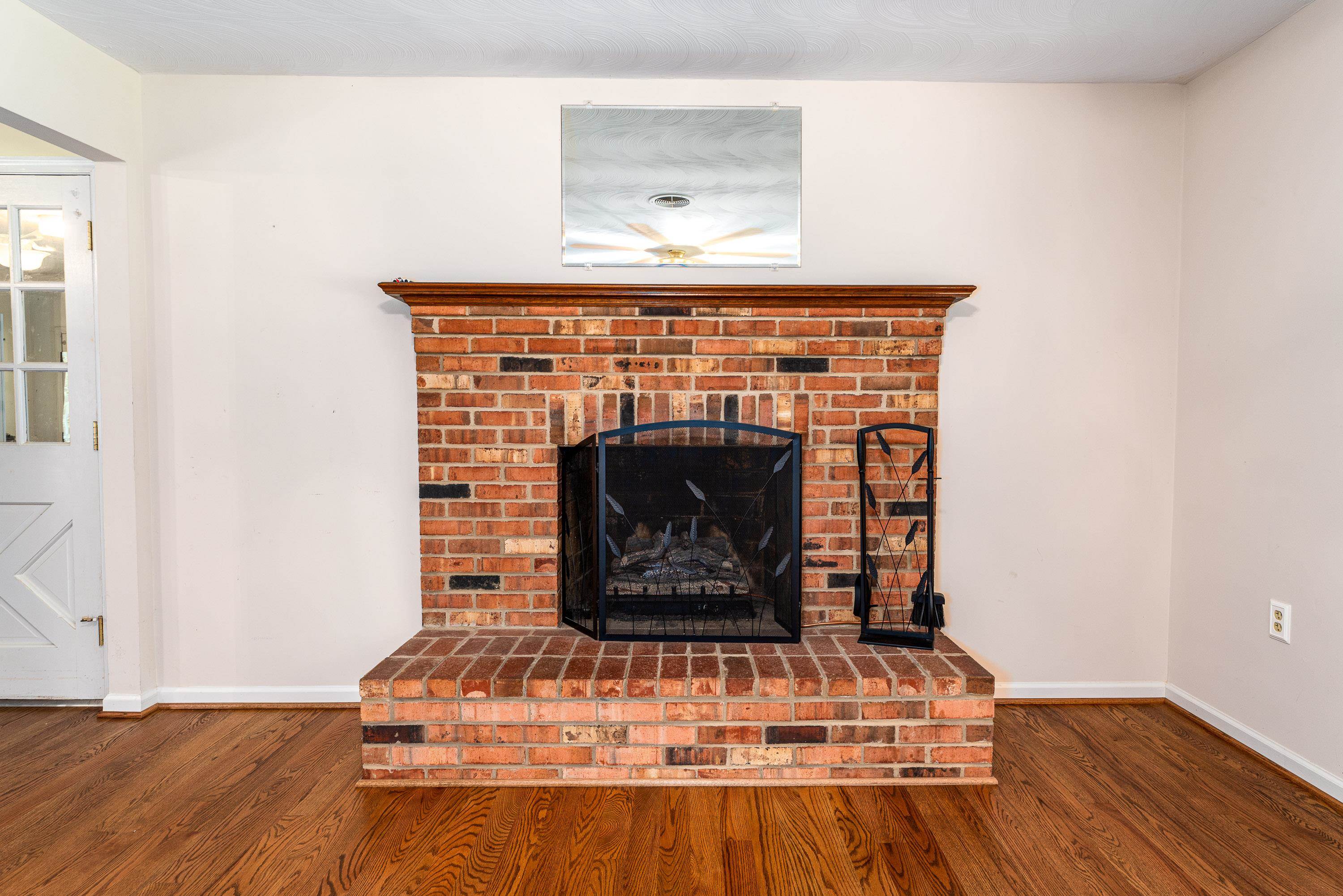 431 Springfield Estates Drive Rileyville, VA 22650 - Photo 13 of 44 a view of fireplace with wooden floor