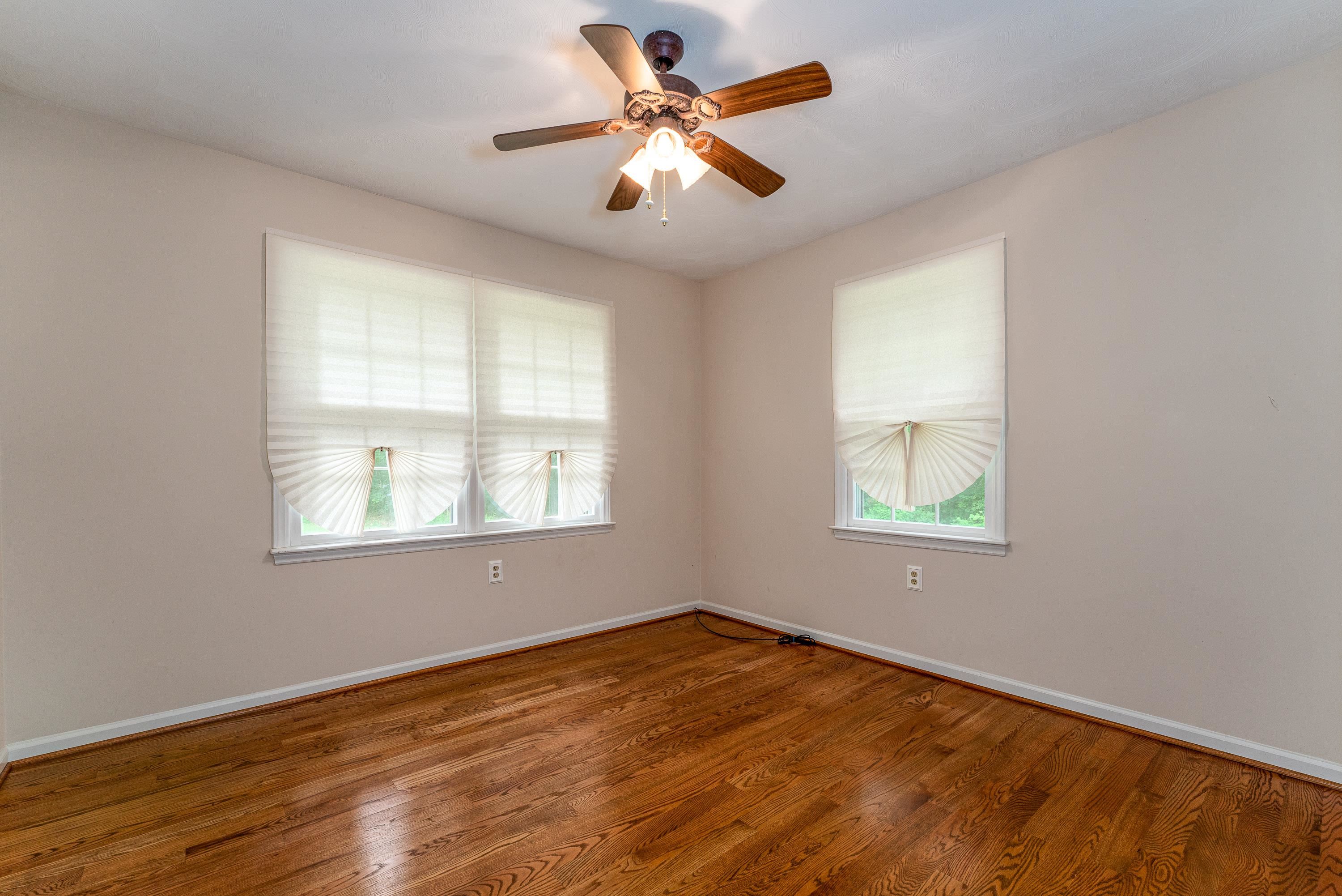 431 Springfield Estates Drive Rileyville, VA 22650 - Photo 17 of 44 a view of an empty room with window and wooden floor