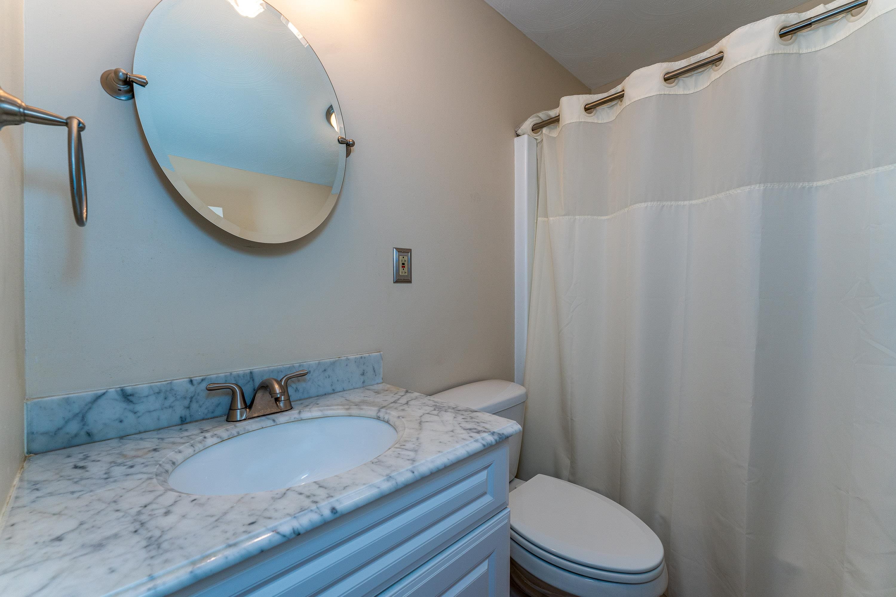 431 Springfield Estates Drive Rileyville, VA 22650 - Photo 18 of 44 a bathroom with a granite countertop sink mirror vanity and a toilet