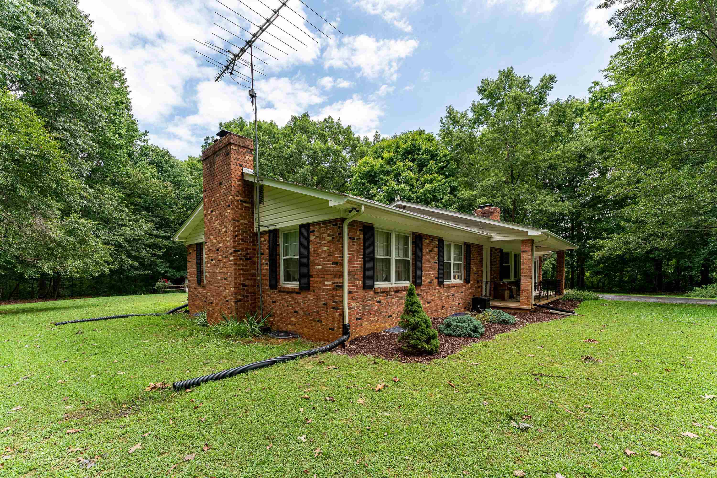 431 Springfield Estates Drive Rileyville, VA 22650 - Photo 23 of 44 a front view of house with yard and green space