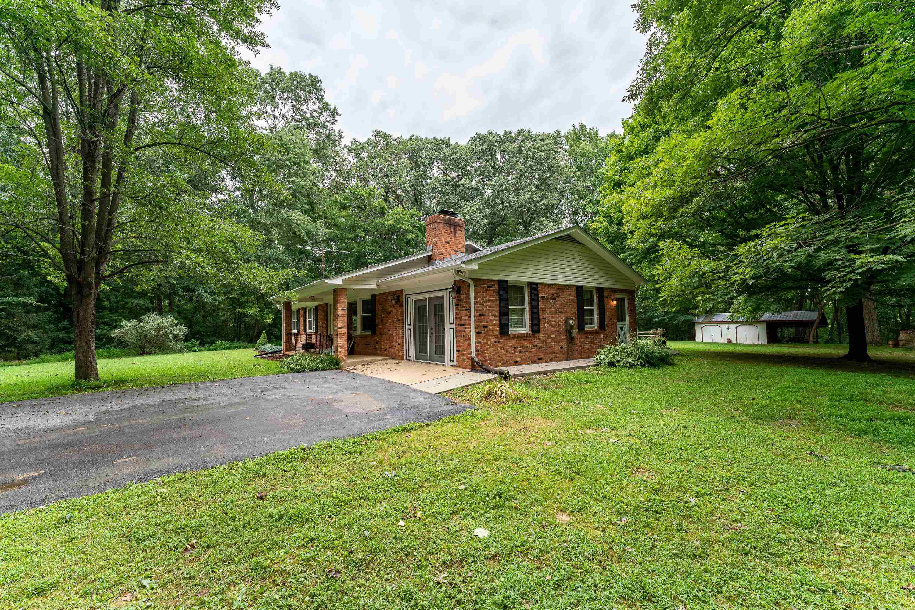 431 Springfield Estates Drive Rileyville, VA 22650 - Photo 24 of 44 a front view of a house with a garden