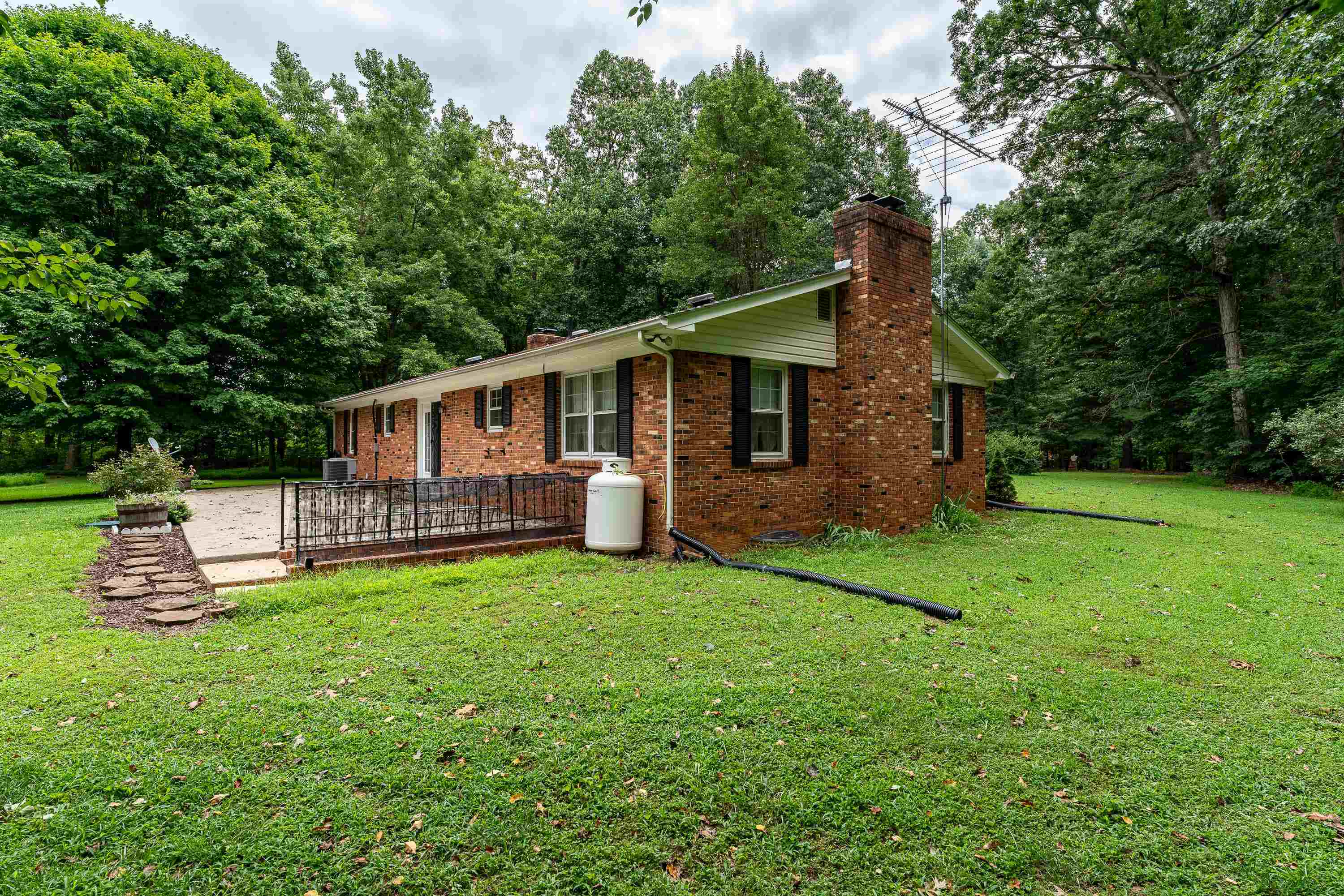 431 Springfield Estates Drive Rileyville, VA 22650 - Photo 27 of 44 a view of a house with a yard and sitting area