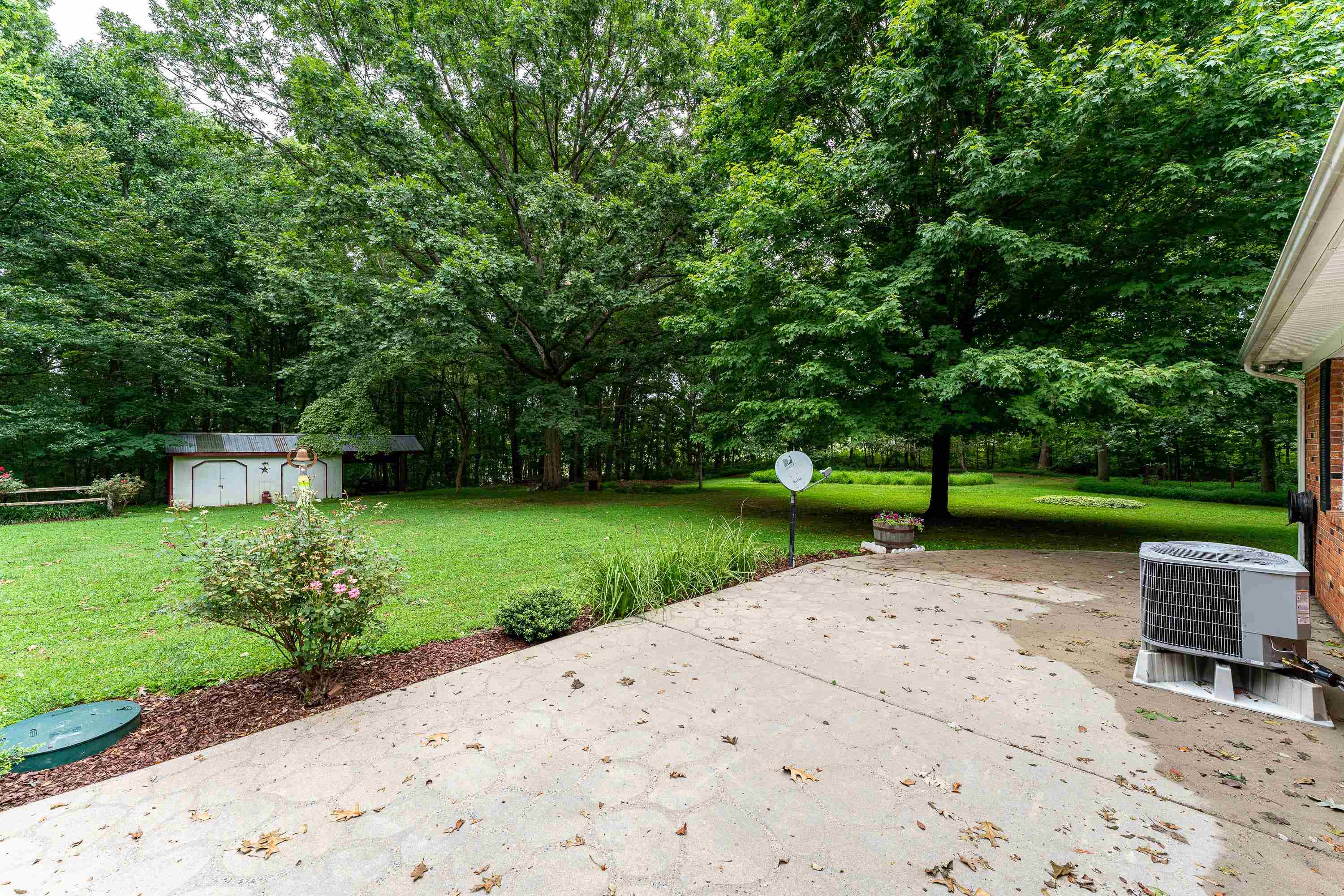 431 Springfield Estates Drive Rileyville, VA 22650 - Photo 29 of 44 a view of a garden with plants and a bench