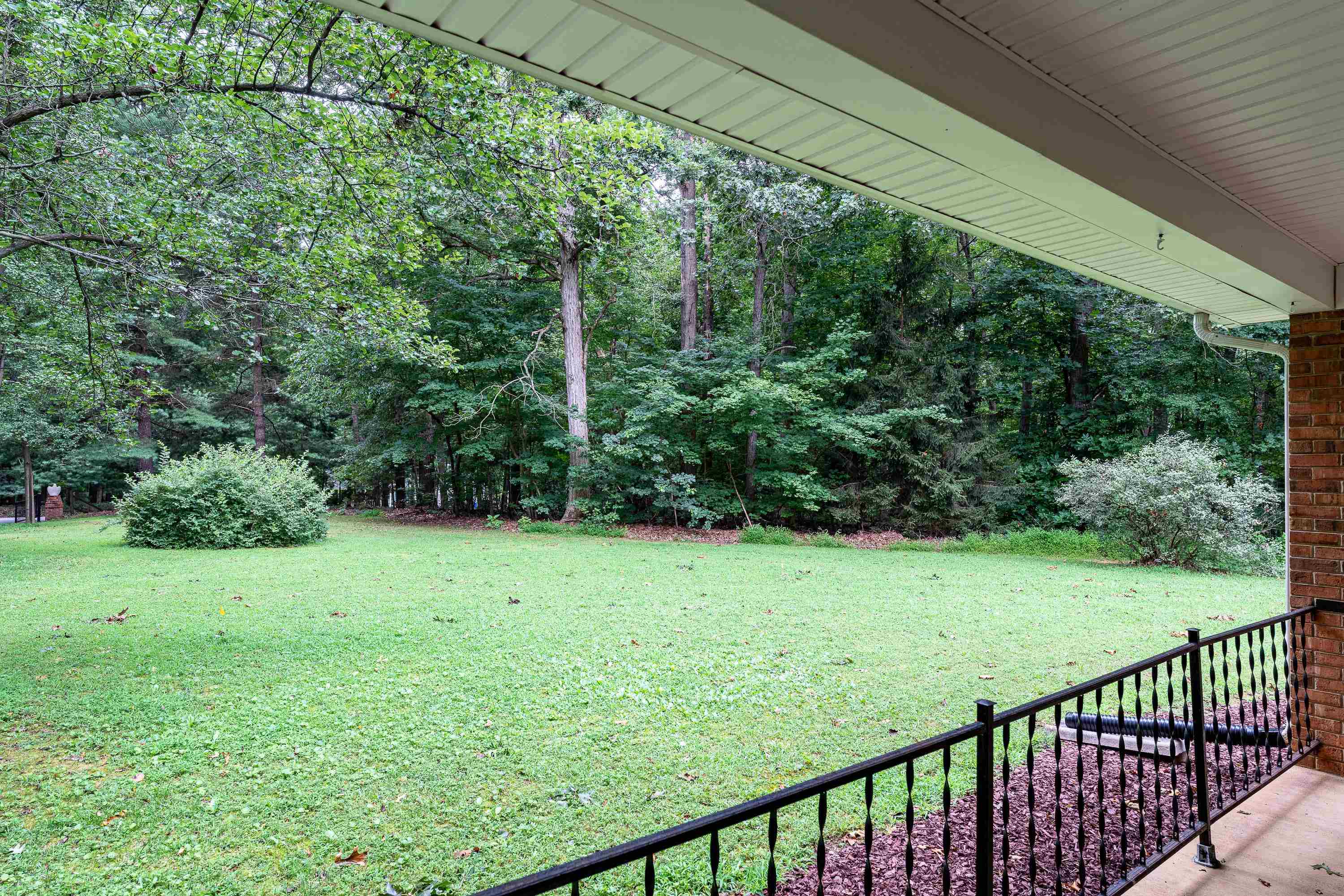 431 Springfield Estates Drive Rileyville, VA 22650 - Photo 4 of 44 a view of a yard with a trees in the background