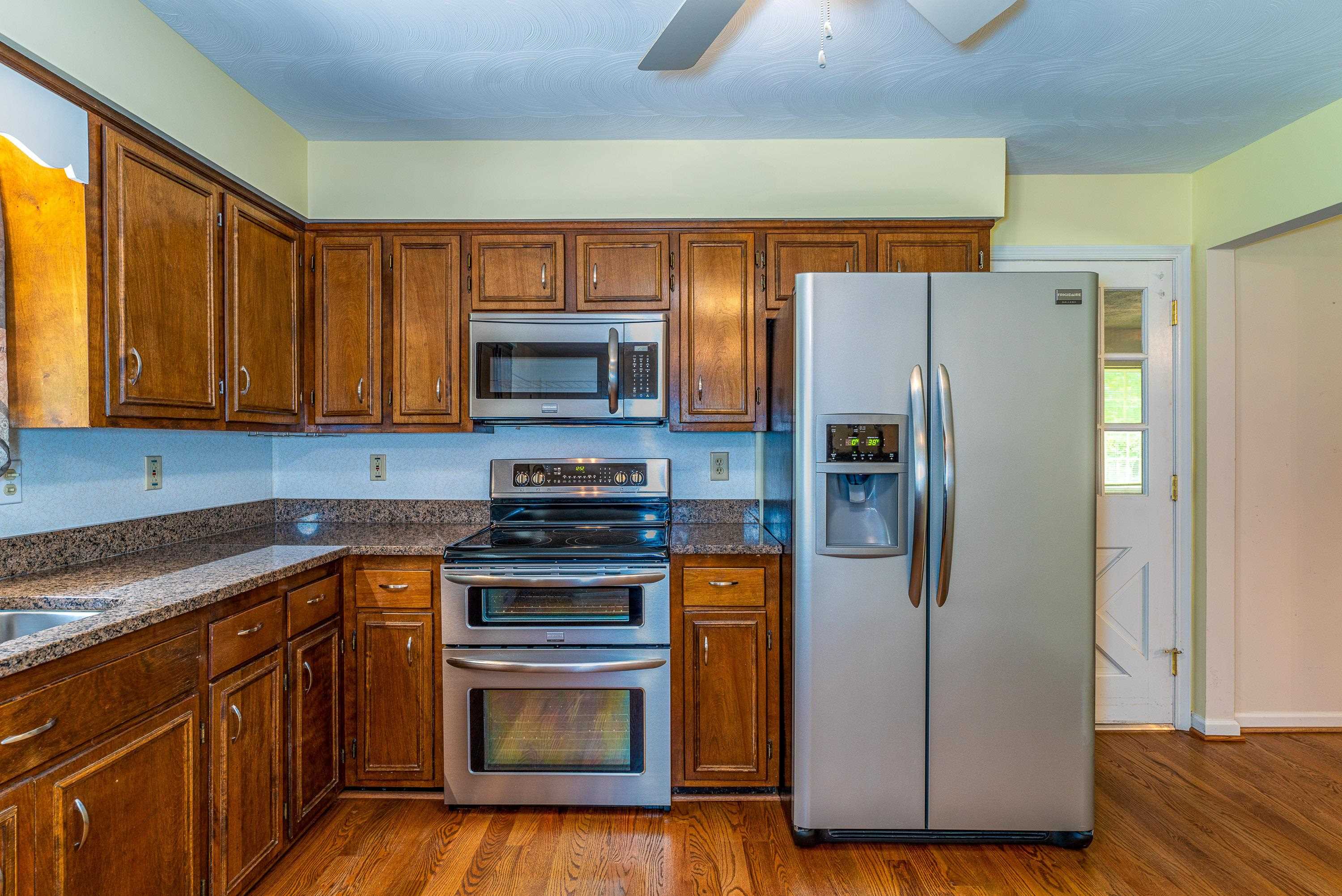 431 Springfield Estates Drive Rileyville, VA 22650 - Photo 8 of 44 a kitchen with stainless steel appliances granite countertop a refrigerator stove and sink