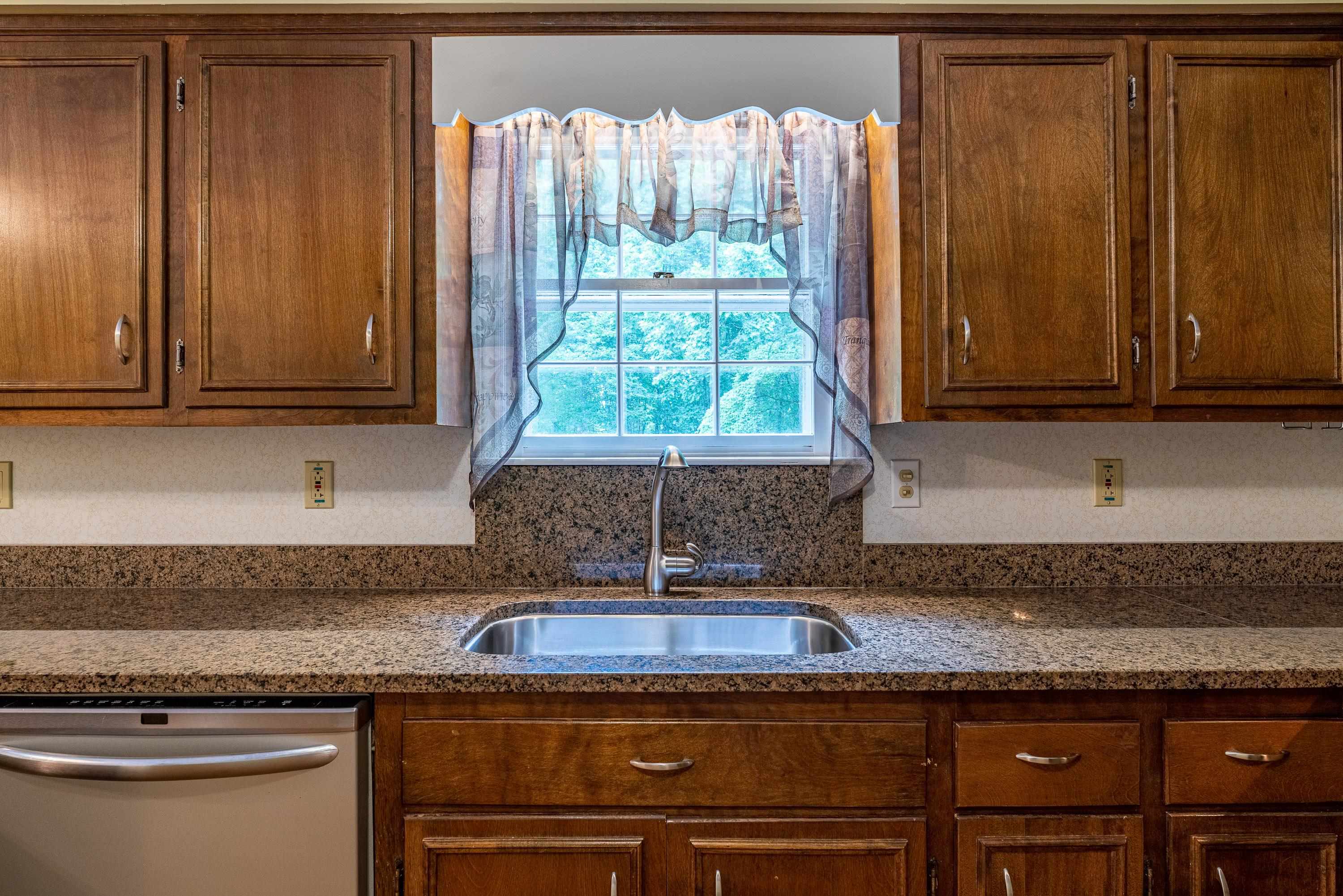 431 Springfield Estates Drive Rileyville, VA 22650 - Photo 9 of 44 a kitchen with granite countertop cabinets and window