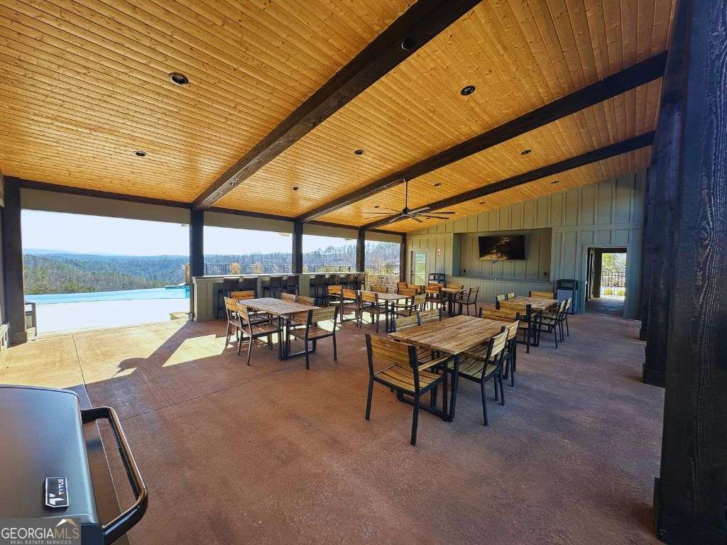 Lot 147 Creekside Crossing Talking Rock, GA 30175 - Photo 43 of 49 a view of a patio with dining table and chairs