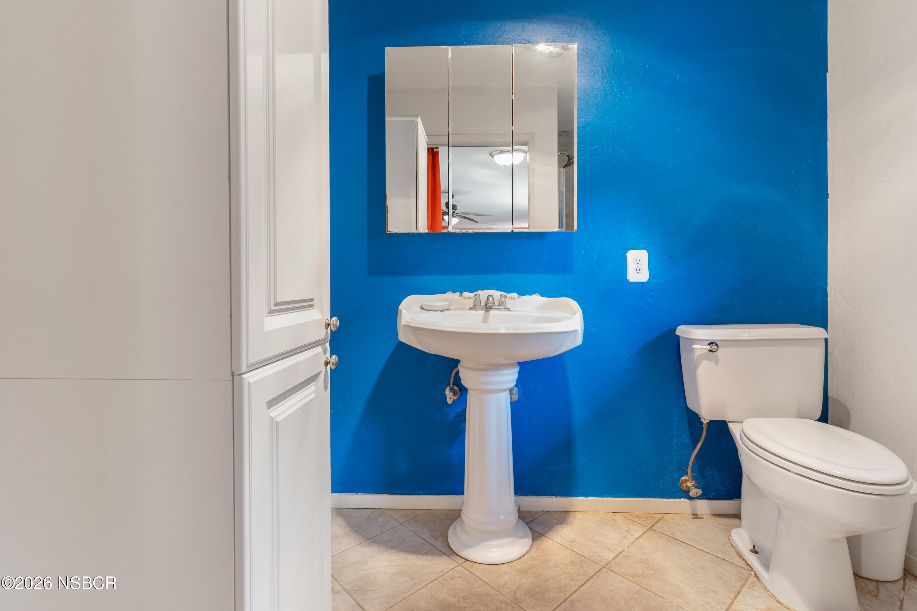 4220 Constellation Road Lompoc, CA 93436 - Photo 17 of 22 a bathroom with a sink toilet and a mirror