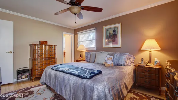 a bedroom with a large bed and a lamp