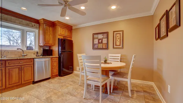 a view of a dining room with furniture and window