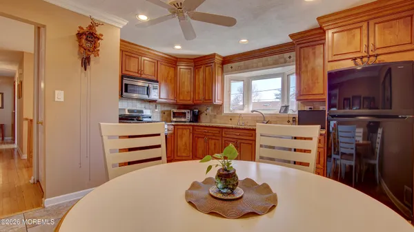 a kitchen with a appliances and cabinets