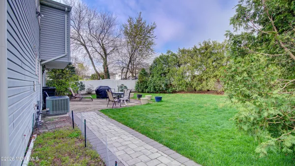 a view of a house with a backyard