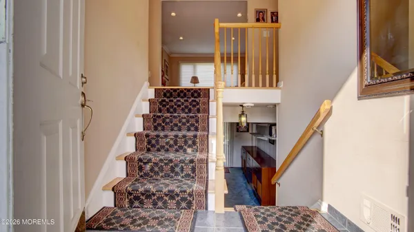 a view of entryway with furniture and rug