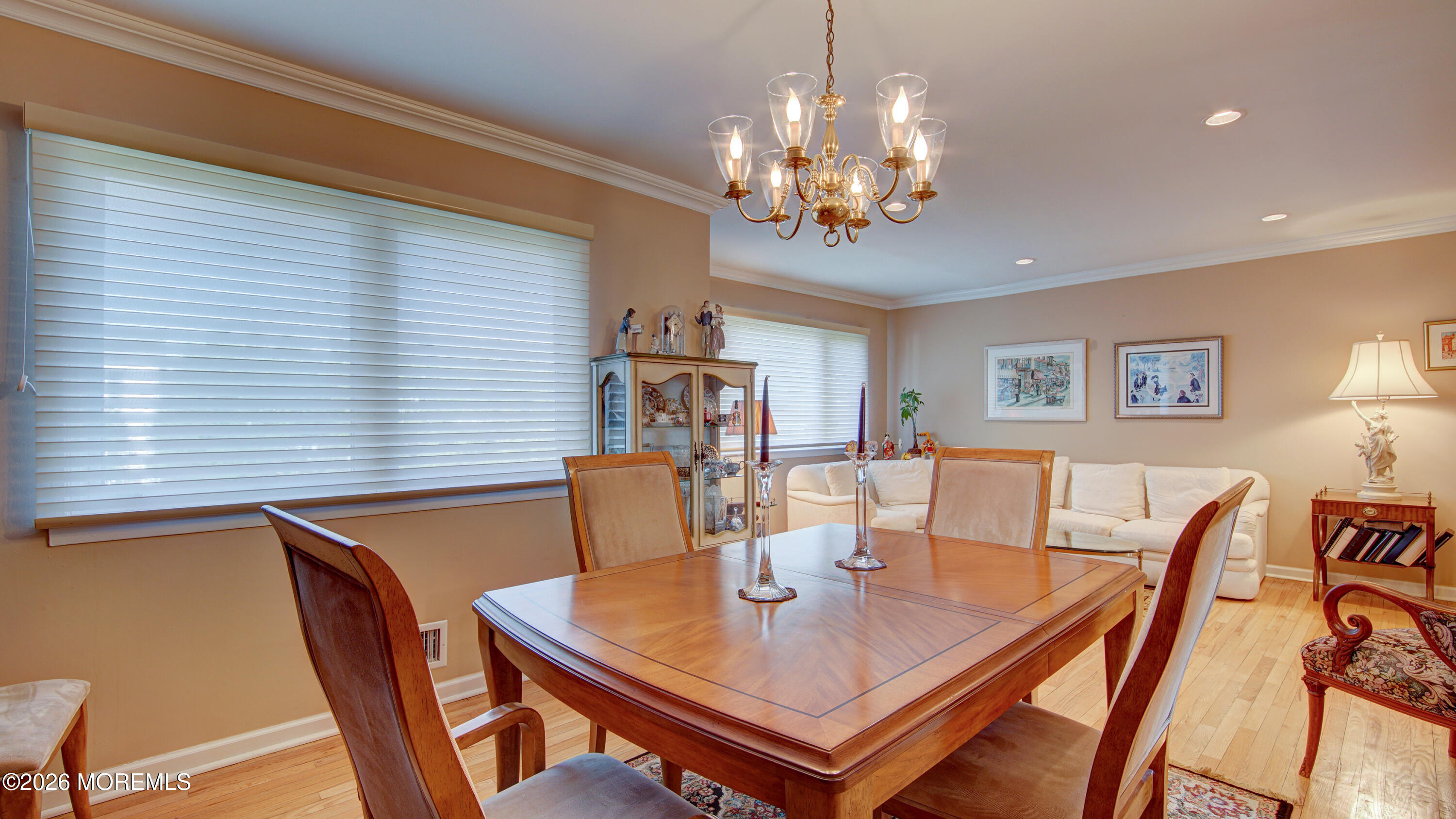 12 Cavan Lane Hazlet, NJ 07730 - Photo 10 of 34 a view of a dining room with furniture a chandelier and wooden floor