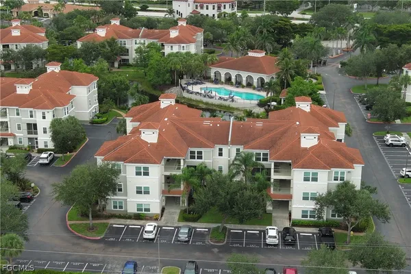 an aerial view of house with yard swimming pool and outdoor seating