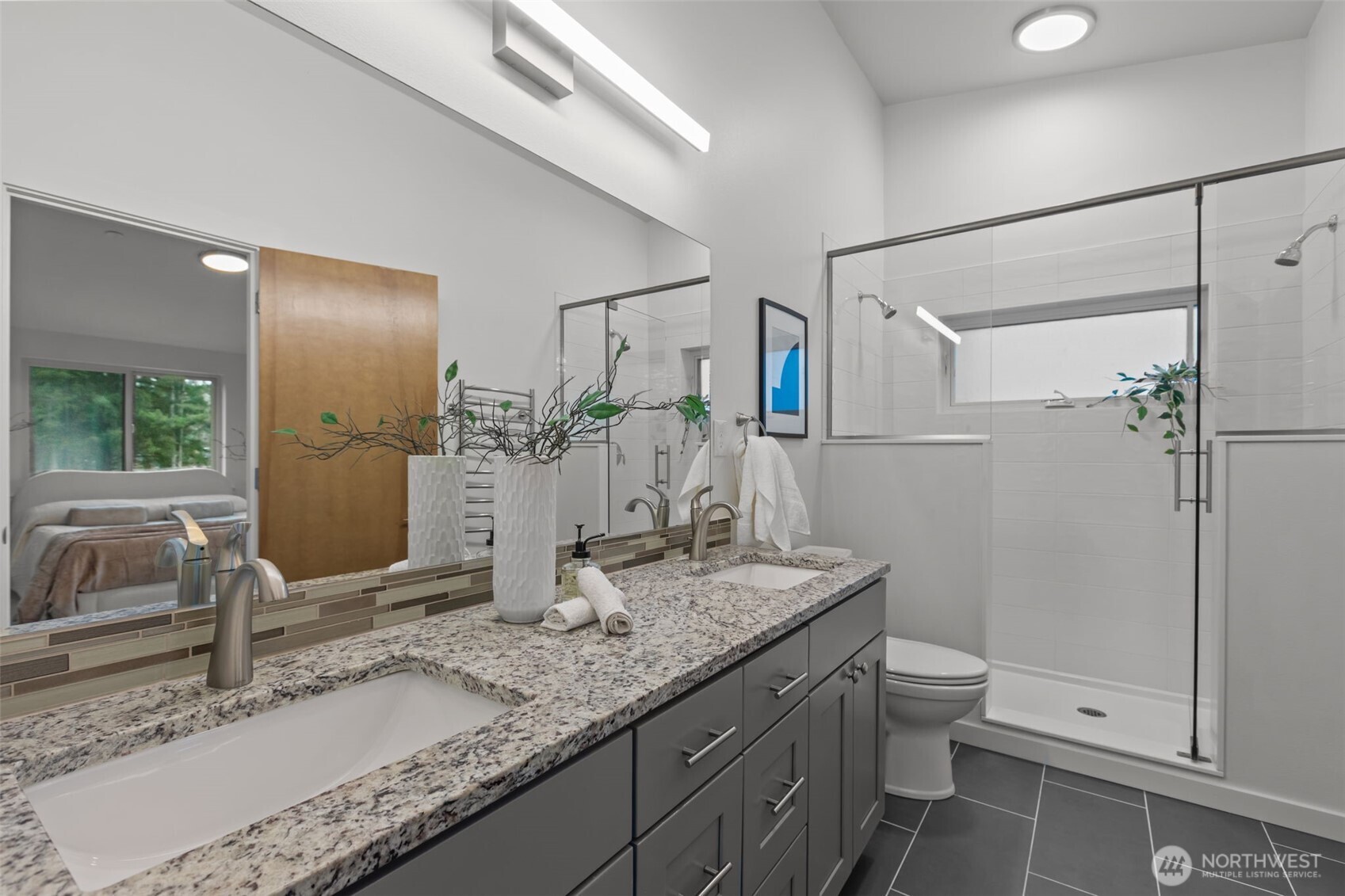 1402 194th Street Southeast, Unit 1 Bothell, WA 98012 - Photo 17 of 31 a bathroom with a granite countertop sink toilet and shower