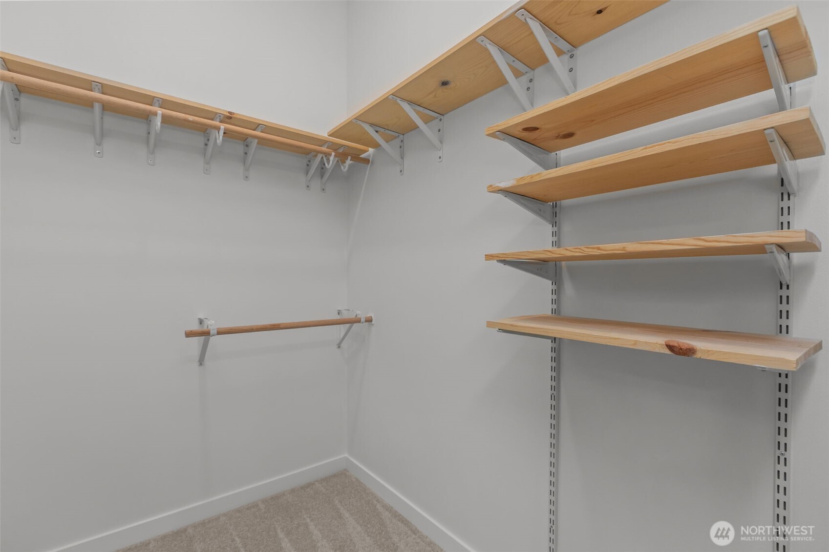 1402 194th Street Southeast, Unit 1 Bothell, WA 98012 - Photo 18 of 31 a view of walk in closet with empty racks