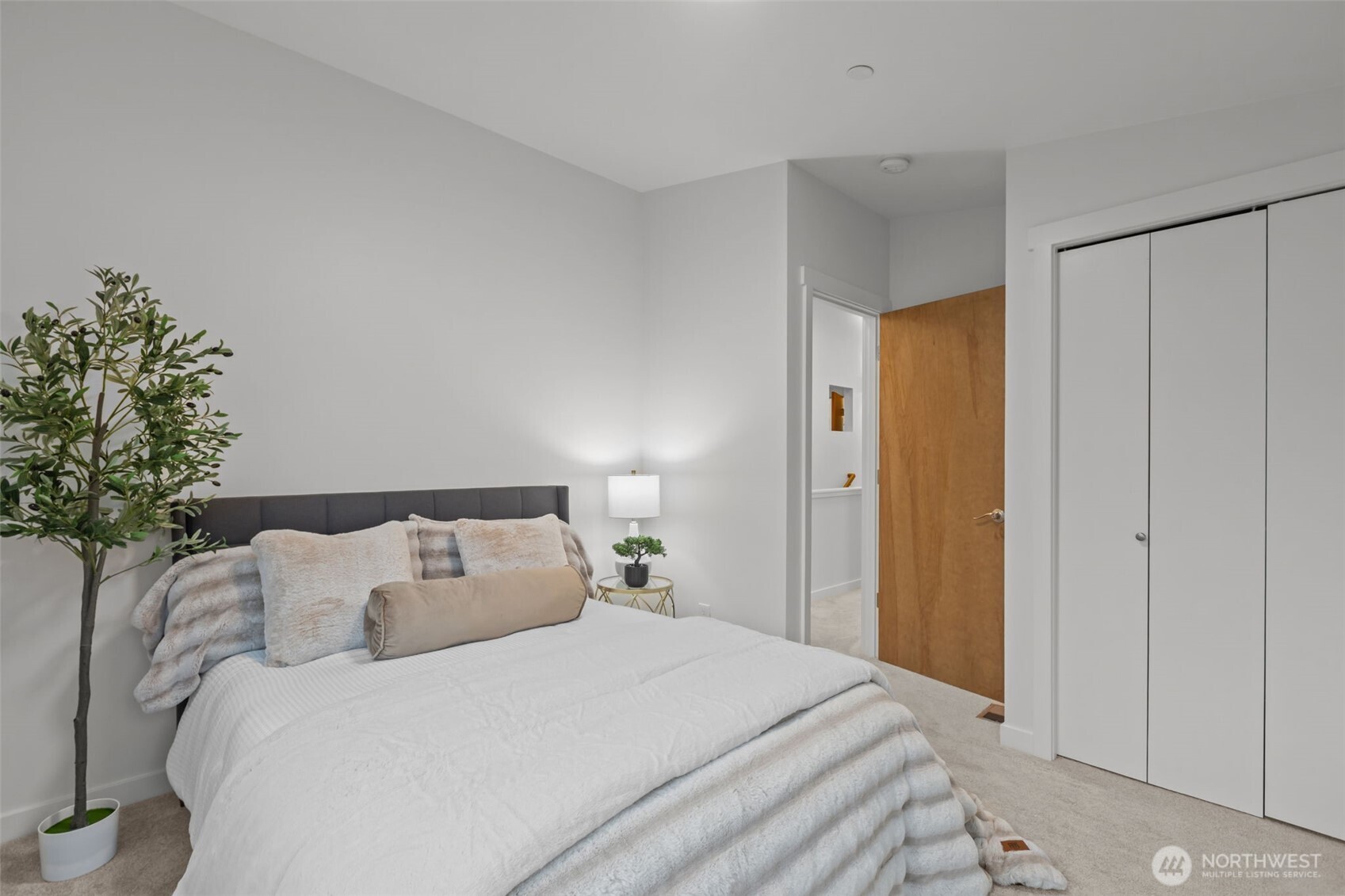 1402 194th Street Southeast, Unit 1 Bothell, WA 98012 - Photo 20 of 31 a bed room with a bed and a plant