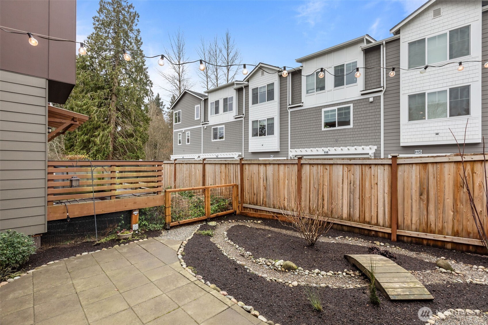 1402 194th Street Southeast, Unit 1 Bothell, WA 98012 - Photo 24 of 31 a view of a house with a small backyard
