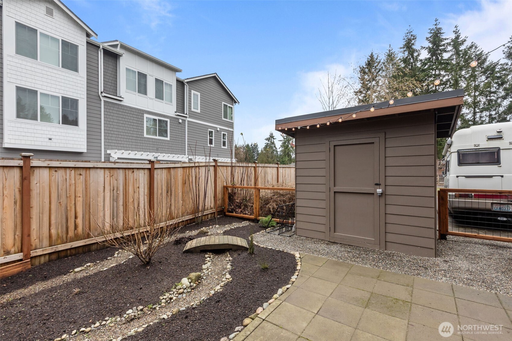 1402 194th Street Southeast, Unit 1 Bothell, WA 98012 - Photo 25 of 31 a view of a house with backyard and furniture