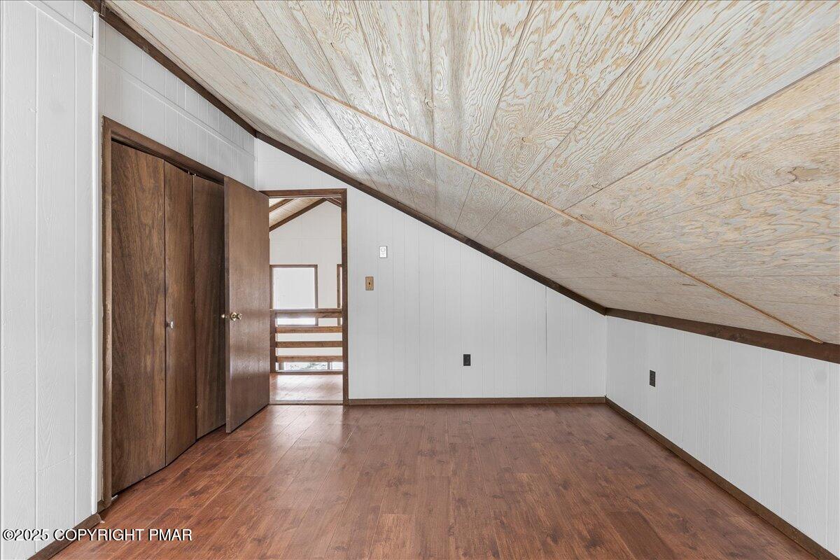 13 Sheffick Road Gouldsboro, PA 18424 - Photo 11 of 38 a view of an empty room with wooden floor and stairs