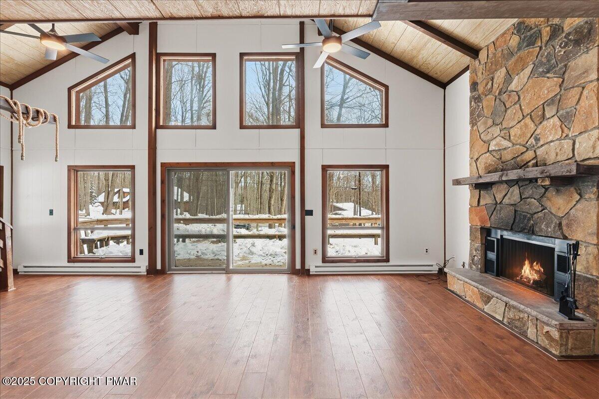 13 Sheffick Road Gouldsboro, PA 18424 - Photo 16 of 38 a view of an empty room with wooden floor and a fireplace