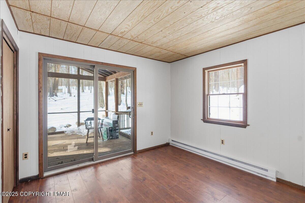 13 Sheffick Road Gouldsboro, PA 18424 - Photo 27 of 38 a view of a livingroom with wooden floor and a floor to ceiling window