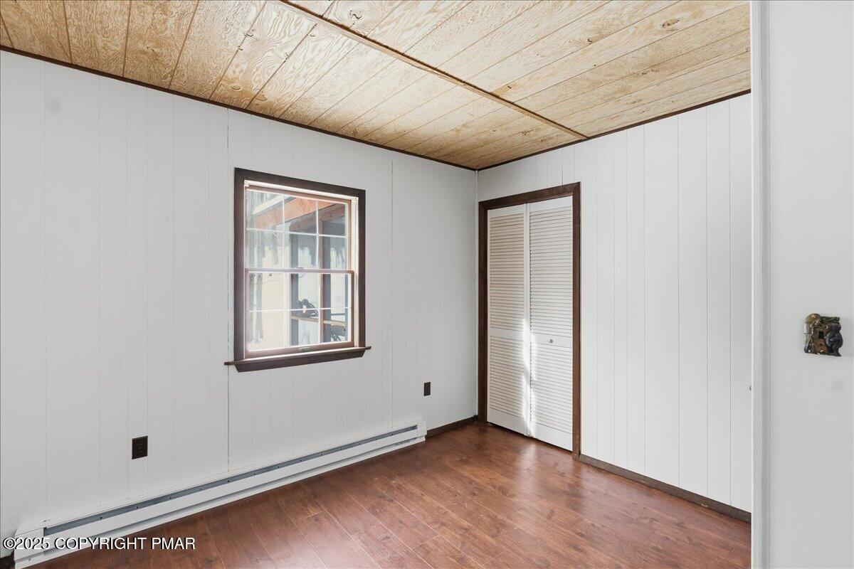 13 Sheffick Road Gouldsboro, PA 18424 - Photo 27 of 46 a view of an empty room with wooden floor and a window