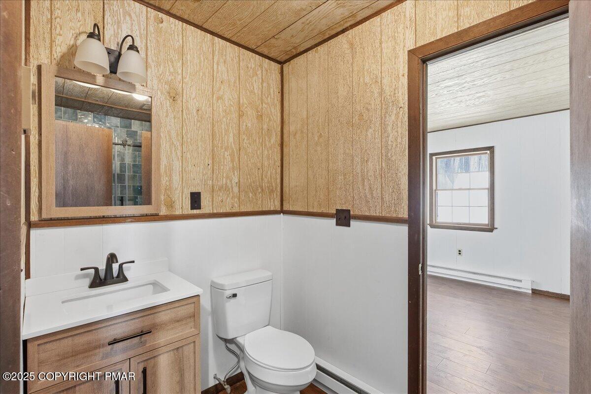 13 Sheffick Road Gouldsboro, PA 18424 - Photo 29 of 46 a bathroom with a sink a toilet and vanity