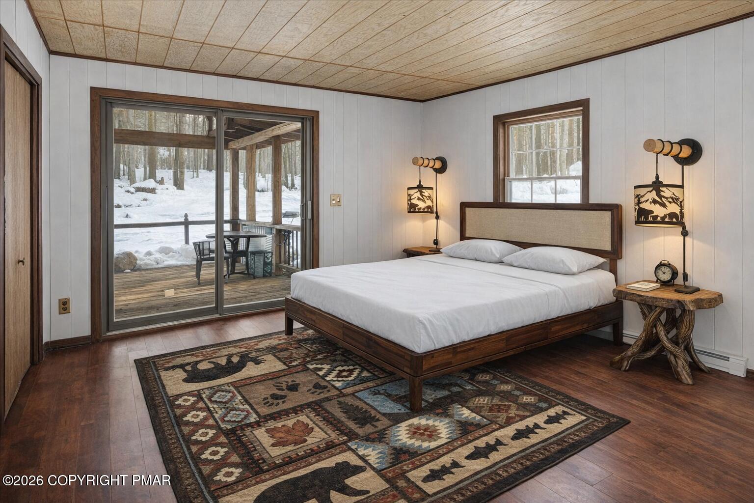 13 Sheffick Road Gouldsboro, PA 18424 - Photo 34 of 46 a bedroom with a bed and wooden floor