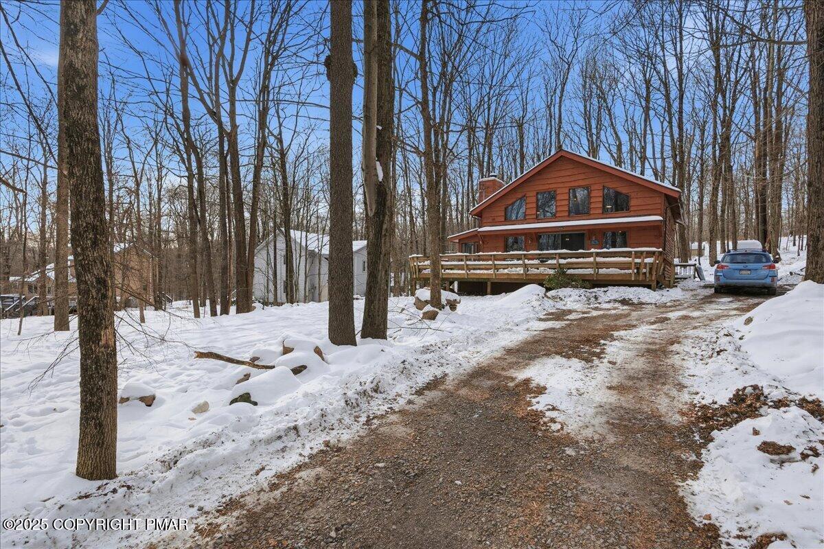 13 Sheffick Road Gouldsboro, PA 18424 - Photo 38 of 38 a front view of a house with a yard covered in snow