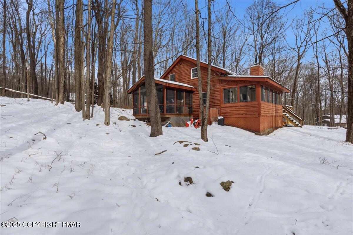 13 Sheffick Road Gouldsboro, PA 18424 - Photo 43 of 46 a front of a house with a yard covered in snow