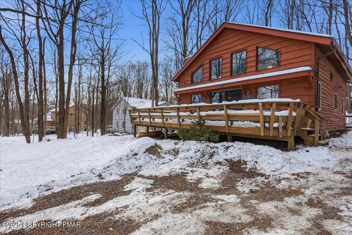 13 Sheffick Road Gouldsboro, PA 18424 - Photo 44 of 46 a front view of a house with a yard covered in snow