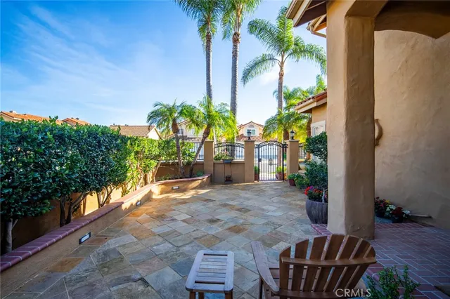 a view of a backyard with plants and a patio