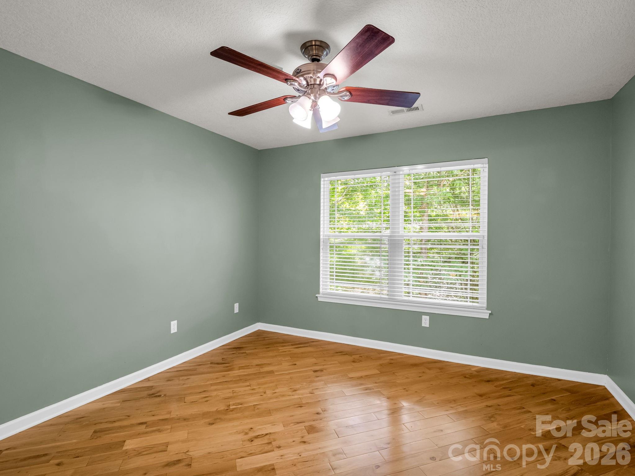 4 Rathfarnham Road, Unit 4F Asheville, NC 28803 - Photo 20 of 33 a view of a room with a ceiling fan and a window