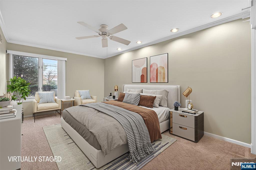 333 Liberty Street, Unit 4 Little Ferry, NJ 07643 - Photo 15 of 29 a bedroom with a large bed and a chandelier