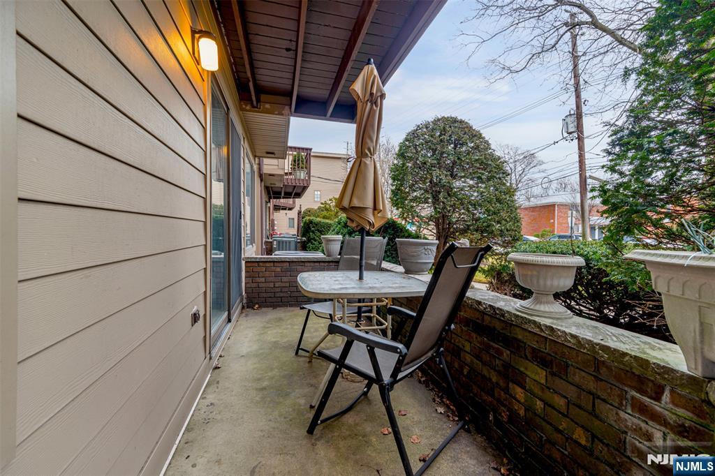 333 Liberty Street, Unit 4 Little Ferry, NJ 07643 - Photo 27 of 29 a view of a chairs and table in the balcony