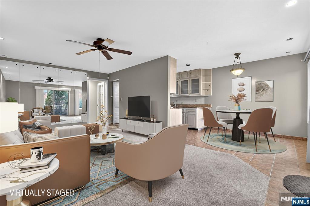 333 Liberty Street, Unit 4 Little Ferry, NJ 07643 - Photo 3 of 29 a living room with furniture kitchen view and a flat screen tv
