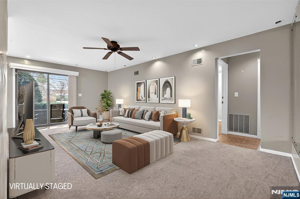 333 Liberty Street, Unit 4 Little Ferry, NJ 07643 - Photo 5 of 29 a living room with furniture ceiling fan and a window