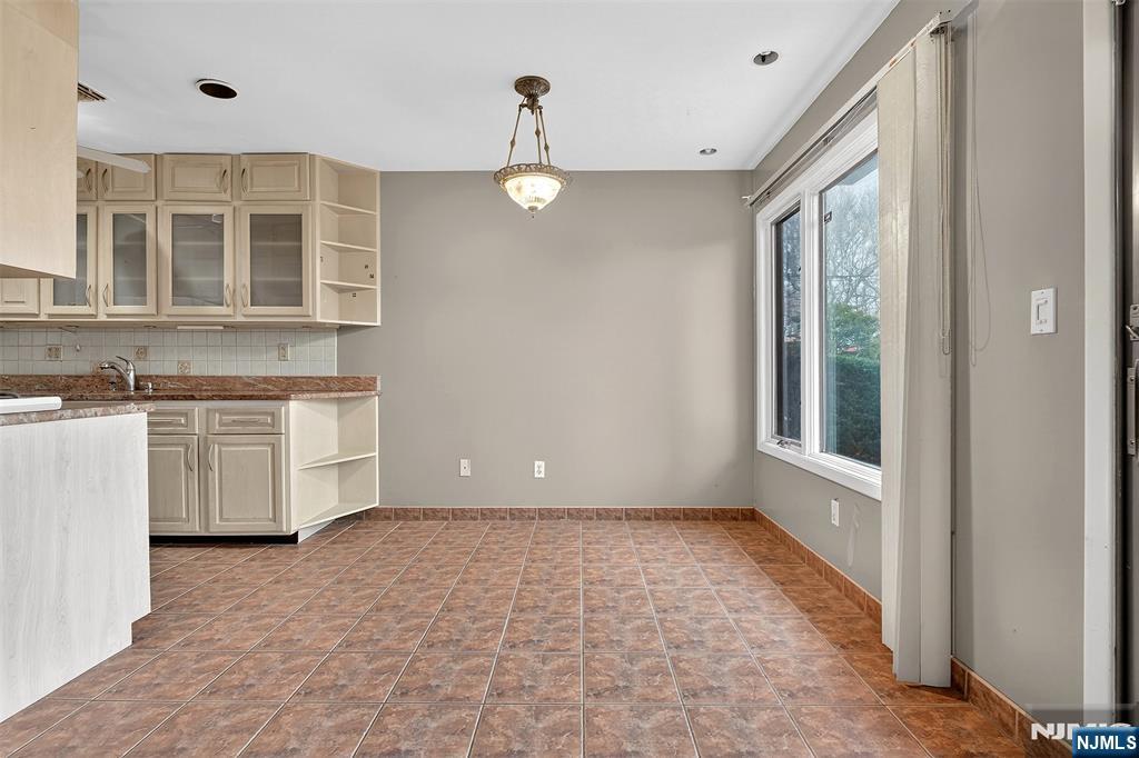 333 Liberty Street, Unit 4 Little Ferry, NJ 07643 - Photo 7 of 29 a view of an empty room with a kitchen