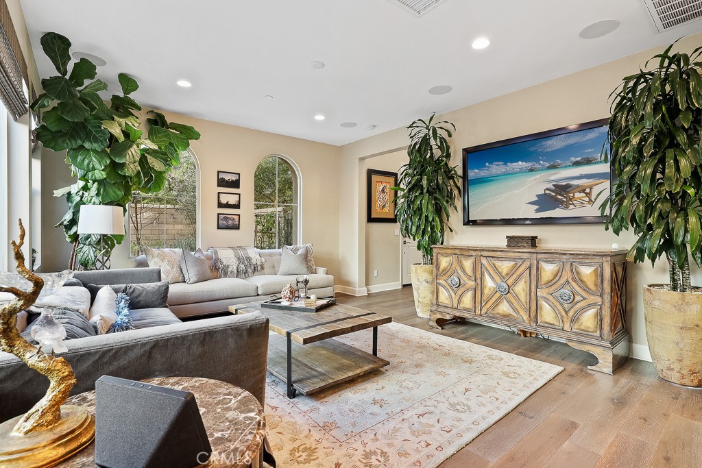 89 Lavender Lake Forest, CA 92630 - Photo 11 of 45 a living room with furniture tv and a potted plant