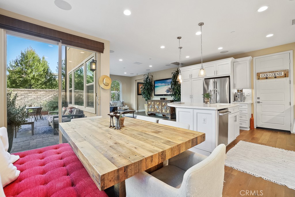 89 Lavender Lake Forest, CA 92630 - Photo 18 of 45 a room with stainless steel appliances kitchen island granite countertop a dining table and chairs in it