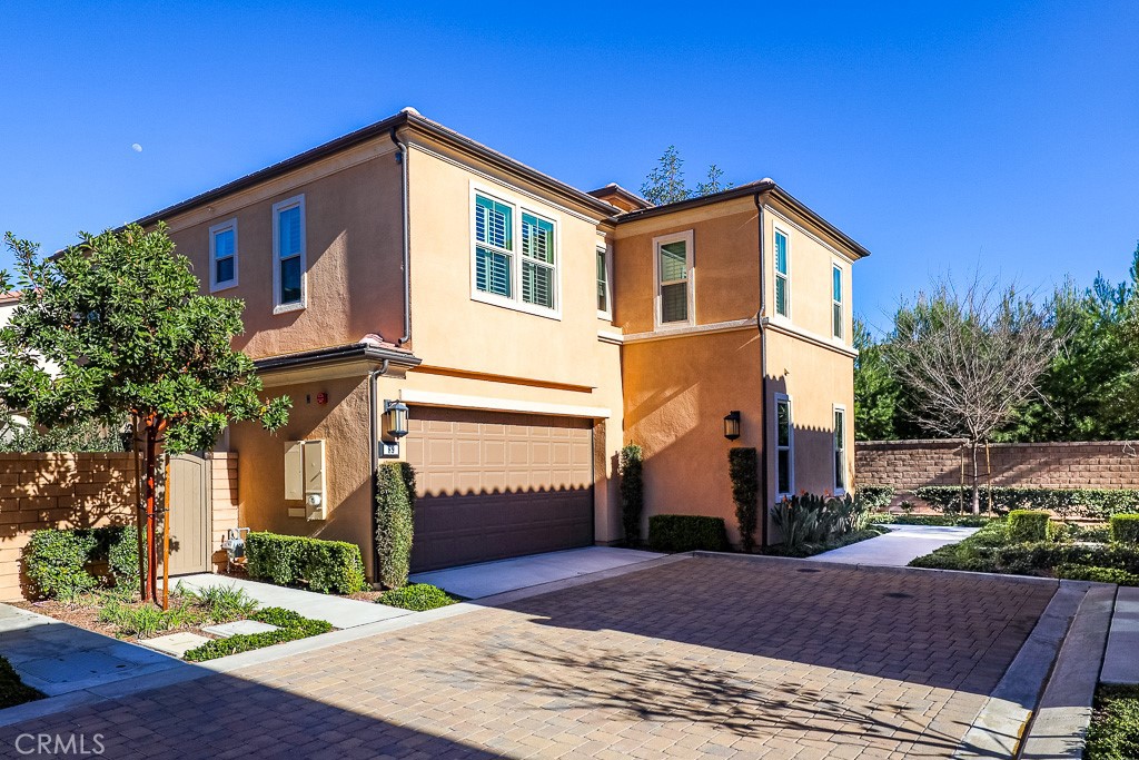 89 Lavender Lake Forest, CA 92630 - Photo 2 of 45 a front view of a house with a yard