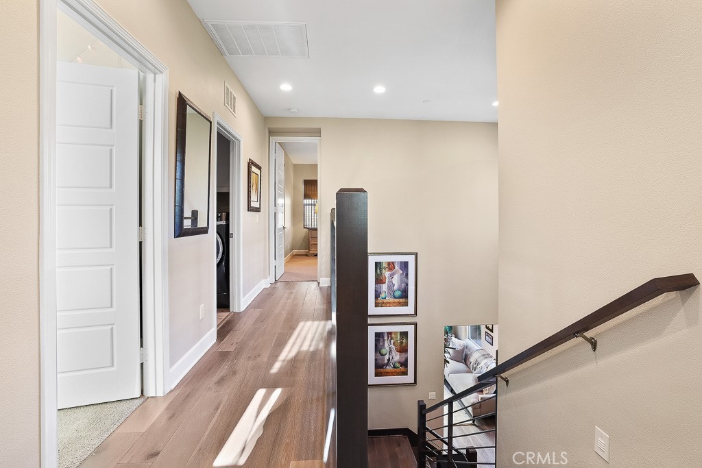 89 Lavender Lake Forest, CA 92630 - Photo 23 of 45 a view of a hallway with wooden floor and staircase