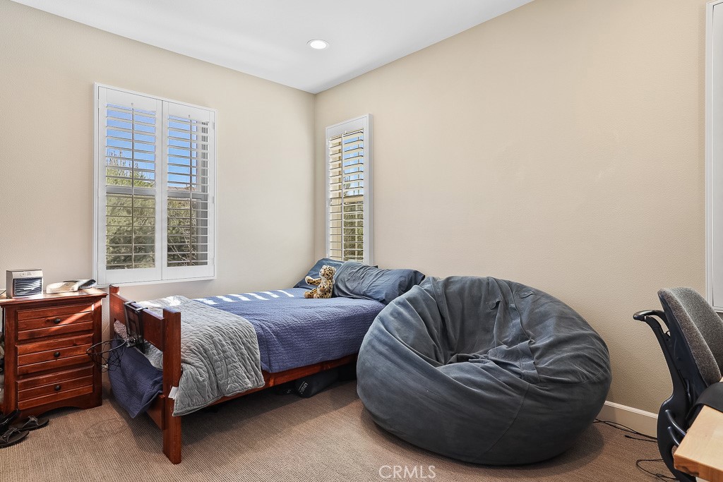89 Lavender Lake Forest, CA 92630 - Photo 25 of 45 a bedroom with bed couch and window