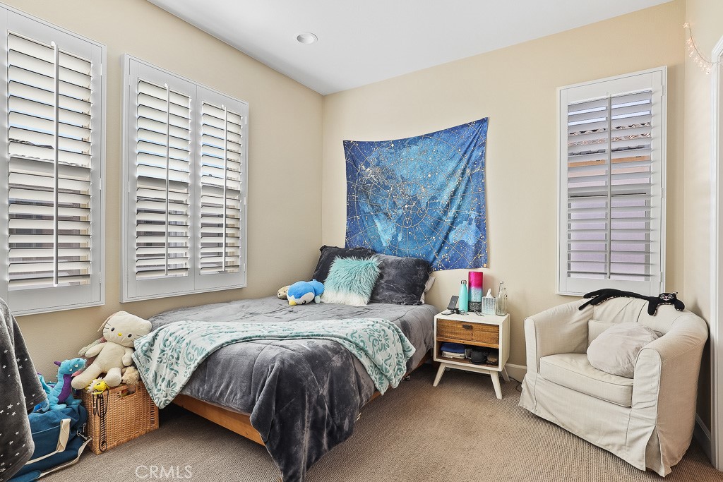 89 Lavender Lake Forest, CA 92630 - Photo 27 of 45 a bedroom with a bed and a couch